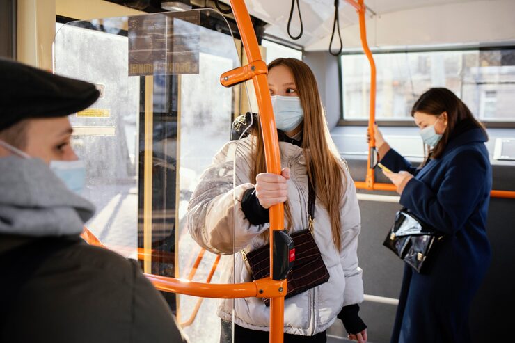 People in public transportation wearing mask