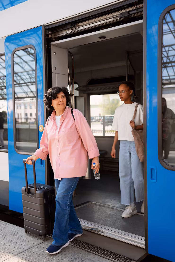 Side view woman and girl traveling by train